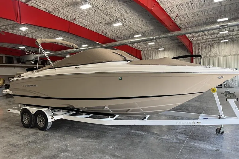 Slide: The Image of 2017 Regal 2700 Bowrider boat on trailer in indoor storage facility. - 13