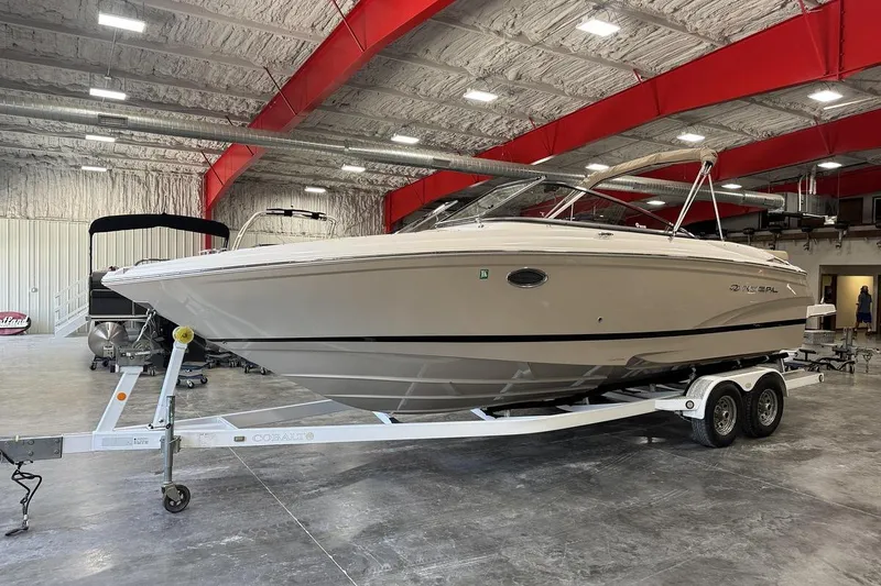 Slide: The Image of 2017 Regal 2700 Bowrider boat on trailer in indoor storage facility. - 2
