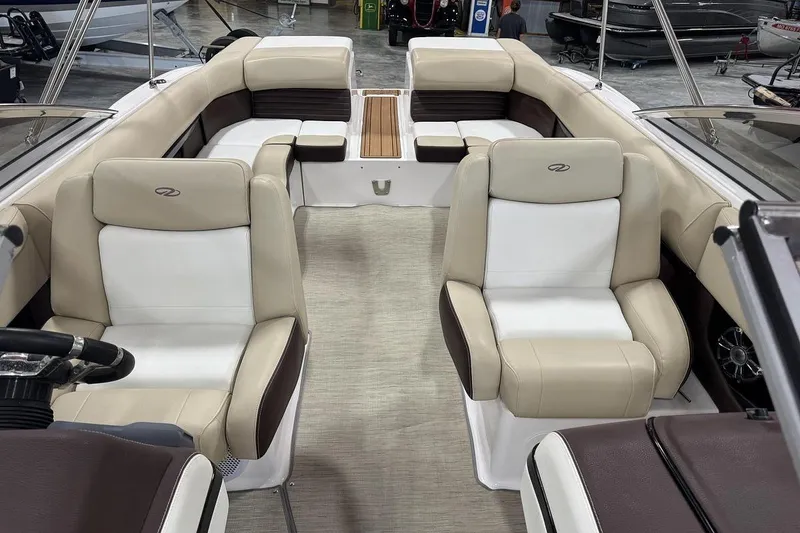 Slide: The Image of 2017 Regal 2700 Bowrider interior with beige and brown seating, spacious layout. - 9