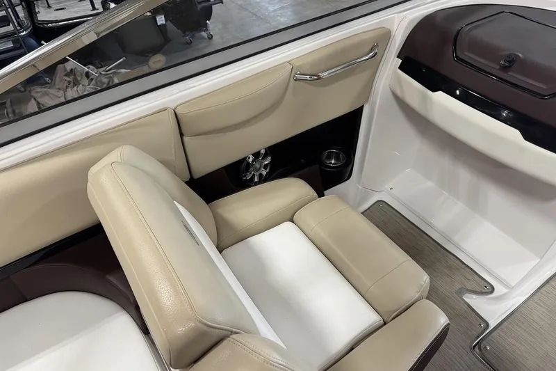 Slide: The Image of Interior of 2017 Regal 2700 Bowrider with beige seating and sleek design. - 10
