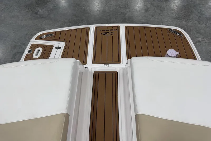 Slide: The Image of 2017 Regal 2700 Bowrider swim platform with teak-style decking and white seating. - 7