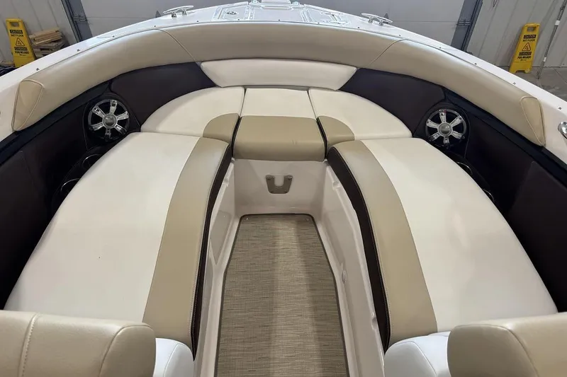 Slide: The Image of 2017 Regal 2700 Bowrider interior with beige and brown seating, featuring built-in speakers. - 12