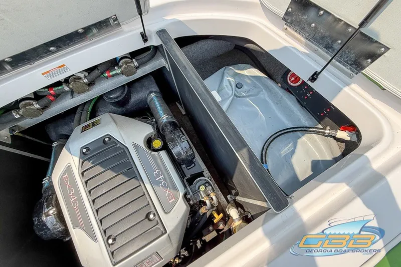 Slide: The Image of Engine compartment of 2008 Nautique Super Air Nautique 210 boat, featuring EX343 engine. - 38