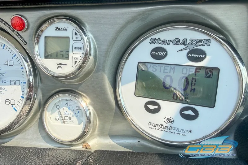 Slide: The Image of Dashboard of a 2008 Nautique Super Air Nautique 210 with gauges and StarGazer display. - 32