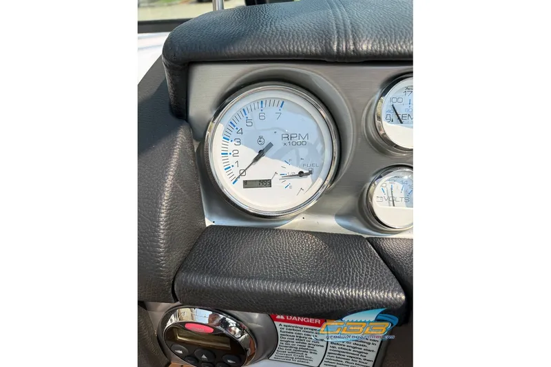 Slide: The Image of Dashboard of 2008 Nautique Super Air Nautique 210 showing RPM and fuel gauges. - 33