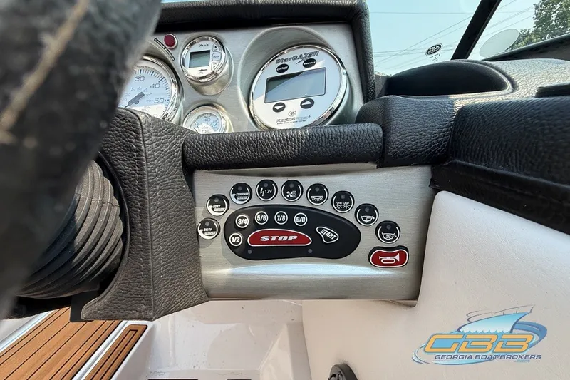 Slide: The Image of Dashboard of 2008 Nautique Super Air Nautique 210 boat with control panel and gauges. - 35