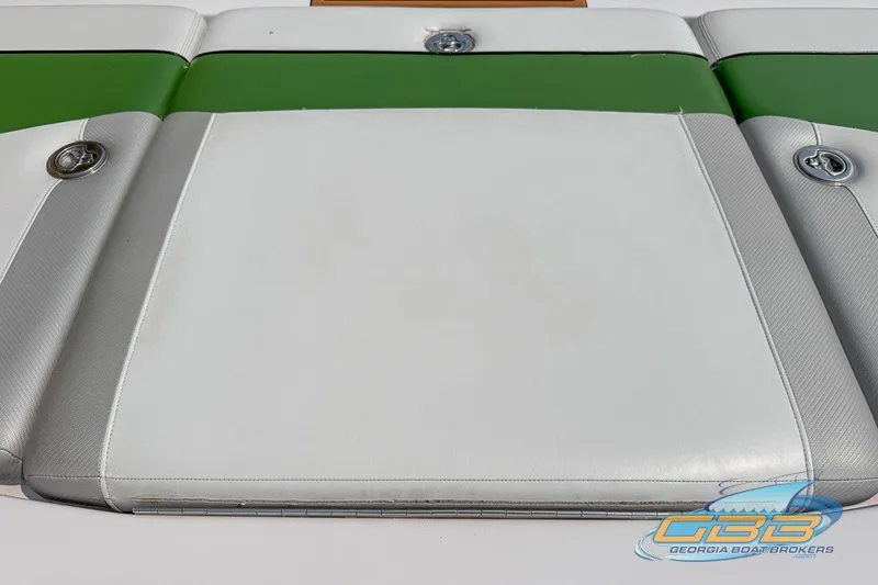 Slide: The Image of 2008 Nautique Super Air Nautique 210 boat seat with green and white upholstery. - 26