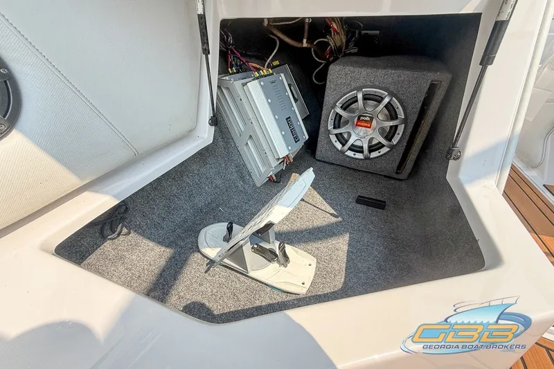 Slide: The Image of 2008 Nautique Super Air Nautique 210 interior with audio system and speaker setup. - 31