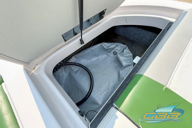 Slide: The Image of Open storage compartment in 2008 Nautique Super Air Nautique 210 boat. - 37