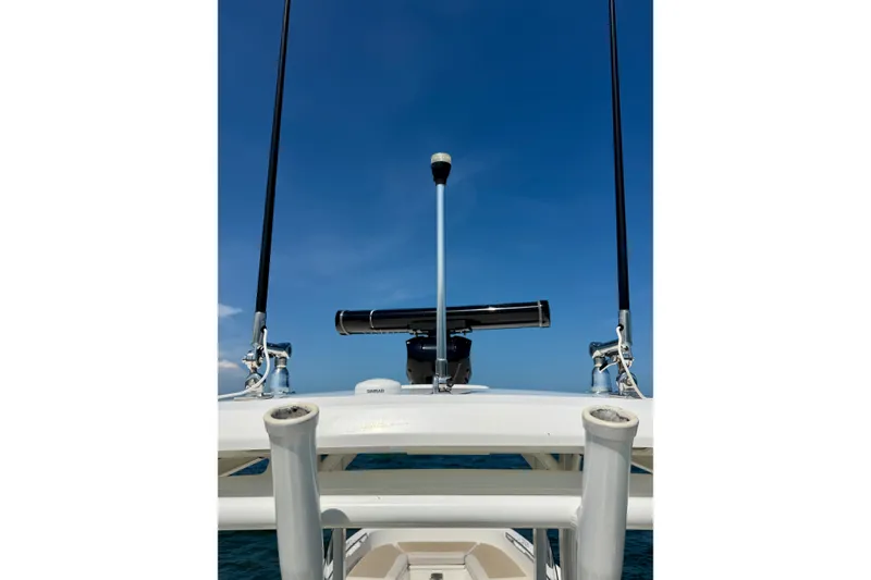 Slide: The Image of 2017 Boston Whaler 270 Dauntless boat with antennas against clear blue sky. - 32
