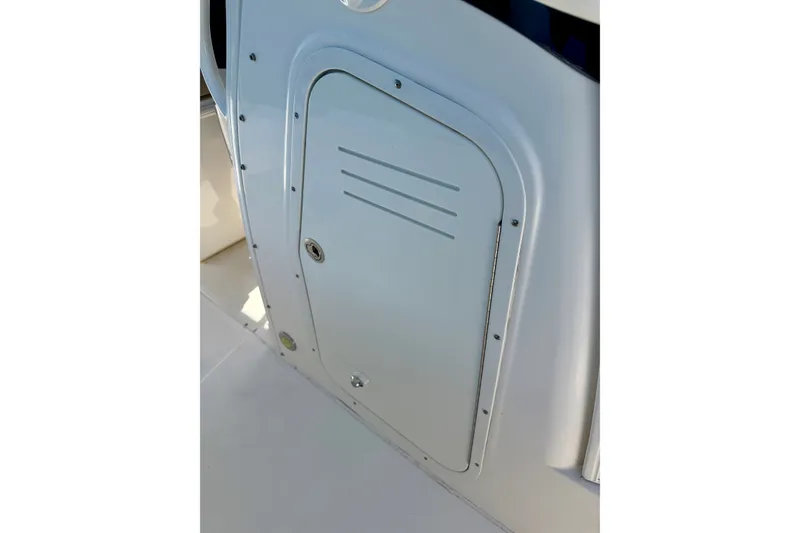 Slide: The Image of 2017 Boston Whaler 270 Dauntless boat compartment door, sleek design, white finish. - 36