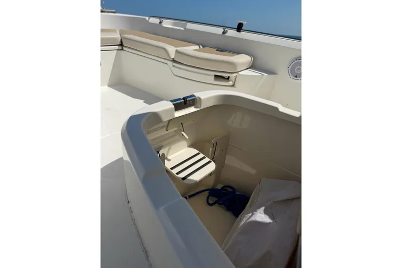 Slide: The Image of 2017 Boston Whaler 270 Dauntless interior with seating and storage compartment. - 18