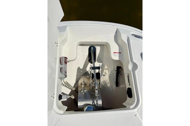 Slide: The Image of Anchor compartment of 2017 Boston Whaler 270 Dauntless boat, showcasing storage and equipment. - 15