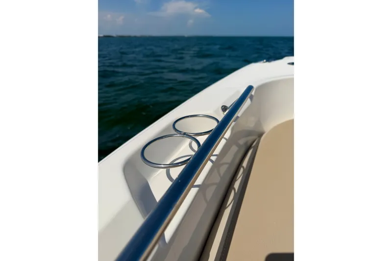 Slide: The Image of 2017 Boston Whaler 270 Dauntless boat detail with cup holders and ocean view. - 35