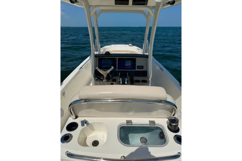 Slide: The Image of 2017 Boston Whaler 270 Dauntless boat interior with helm and ocean view. - 31