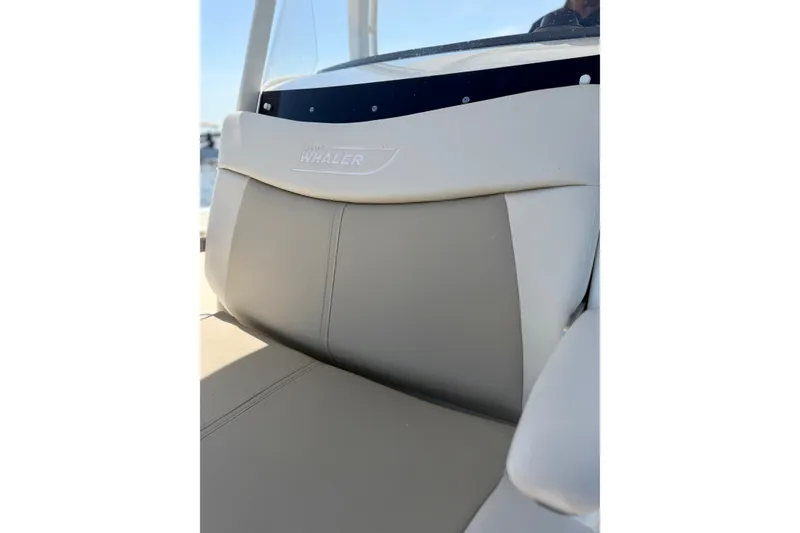 Slide: The Image of Close-up of 2017 Boston Whaler 270 Dauntless boat seat with logo. - 19
