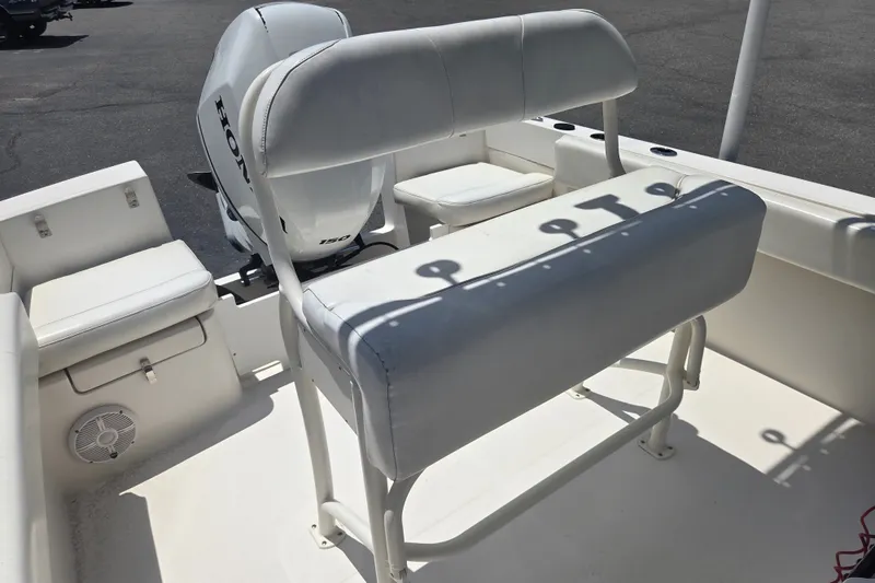 Slide: The Image of 2021 Vanquish 23 CC boat interior with Honda outboard motor and seating. - 7