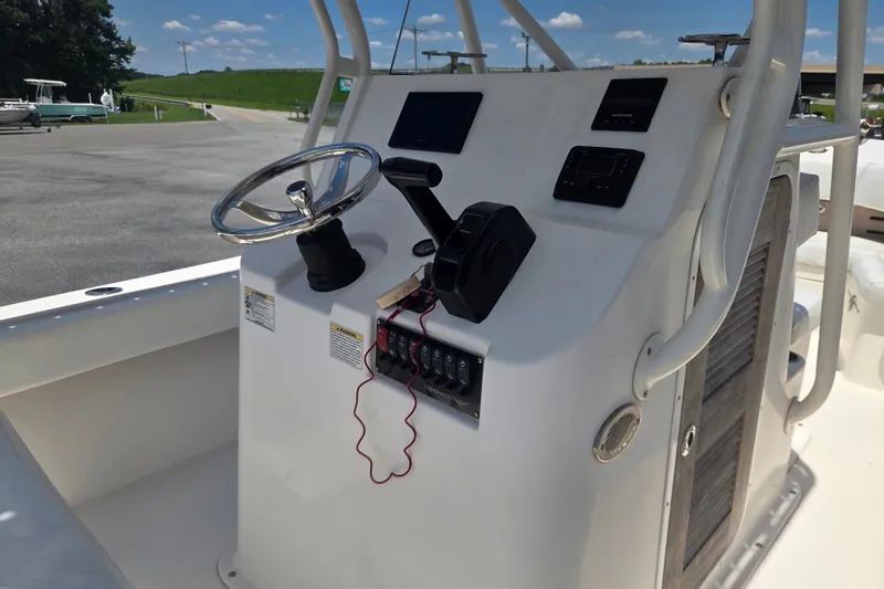 Slide: The Image of Steering console of 2021 Vanquish 23 CC boat with controls and gauges. - 10