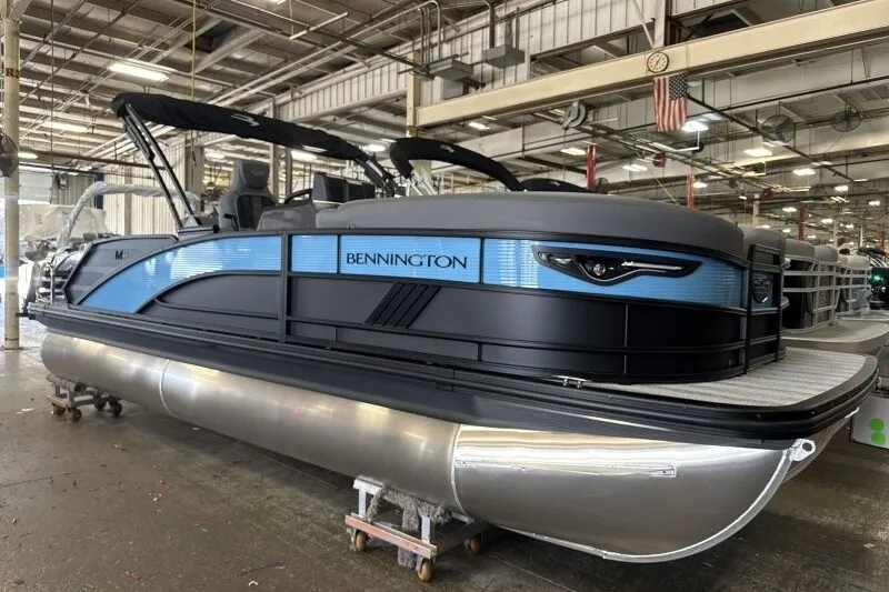 The Image of 2027 Bennington 22 M Swingback pontoon boat in a factory setting. - 0