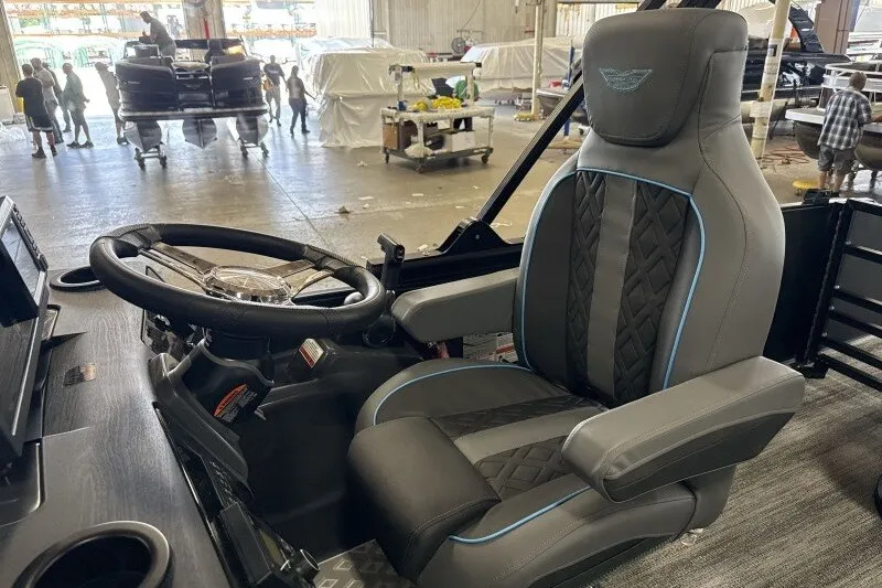 Slide: The Image of Luxurious interior of 2027 Bennington 22 M Swingback boat with premium seating and steering wheel. - 16