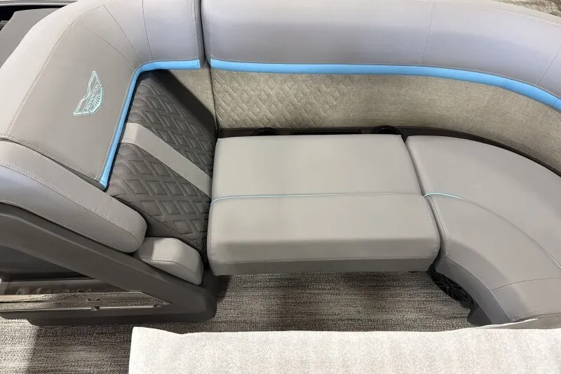 Slide: The Image of 2027 Bennington 22 M Swingback boat seating with gray upholstery and blue accents. - 12