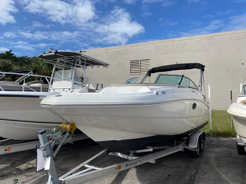 The Image of 2019 Hurricane SD2200 boat on trailer under blue sky. - 1