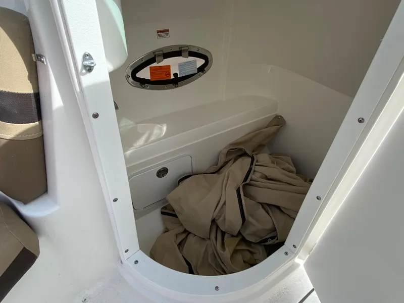 Slide: The Image of Interior storage compartment of 2019 Hurricane SD2200 boat with beige fabric. - 10