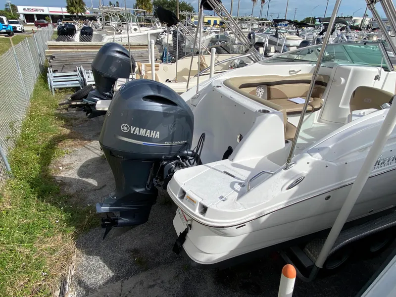 Slide: The Image of 2019 Hurricane SD2200 boat with Yamaha outboard motor in a marina. - 13