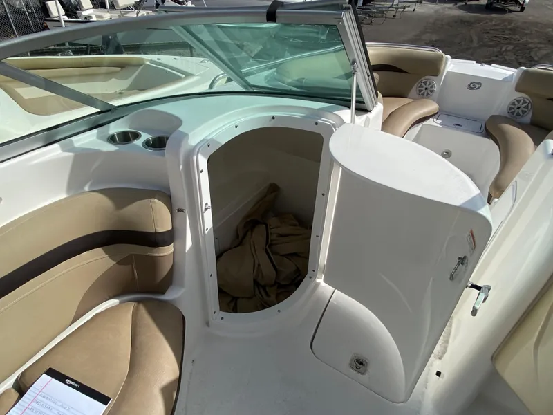 Slide: The Image of 2019 Hurricane SD2200 boat interior with storage compartment and beige seating. - 11