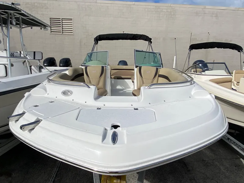 Slide: The Image of 2019 Hurricane SD2200 deck boat in a marina. - 3