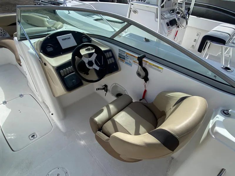 Slide: The Image of 2019 Hurricane SD2200 boat cockpit with steering wheel and control panel. - 7