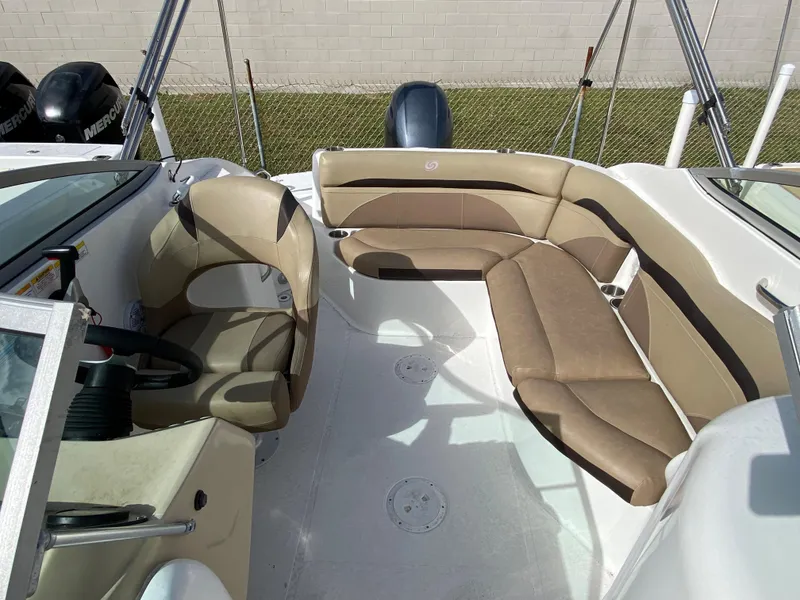 Slide: The Image of 2019 Hurricane SD2200 boat interior with beige seating and steering console. - 6