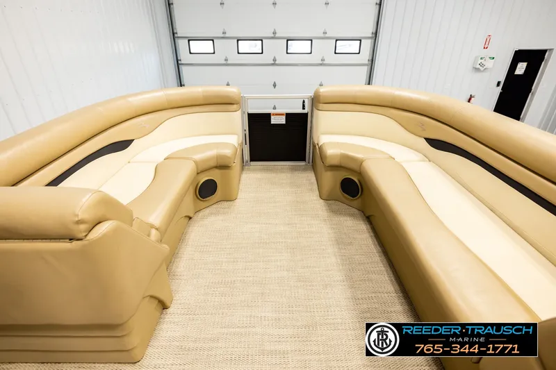 Slide: The Image of Luxurious interior of a 2018 Bennington SX RF pontoon boat with tan seating. - 18