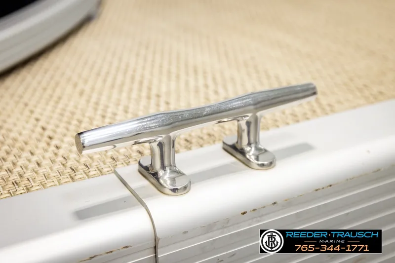 Slide: The Image of Chrome cleat on 2018 Bennington SX RF boat deck, Reeder-Trausch Marine branding visible. - 55