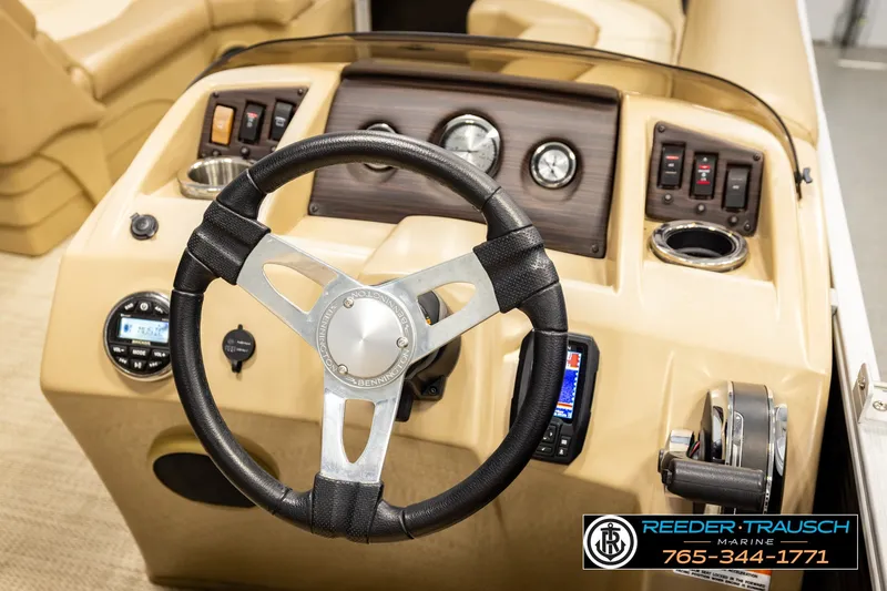 Slide: The Image of Steering console of a 2018 Bennington SX RF boat with controls and gauges. - 29
