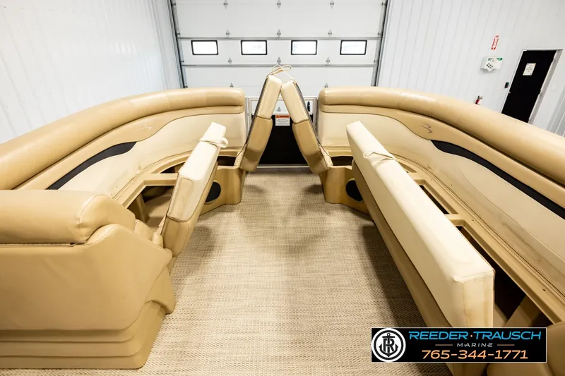 Slide: The Image of Interior of a 2018 Bennington SX RF pontoon boat with tan seating and carpet. - 19