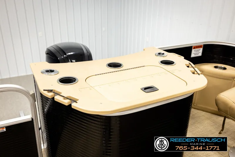 Slide: The Image of 2018 Bennington SX RF boat interior with cup holders and seating, showcased by Reeder Trausch Marine. - 27