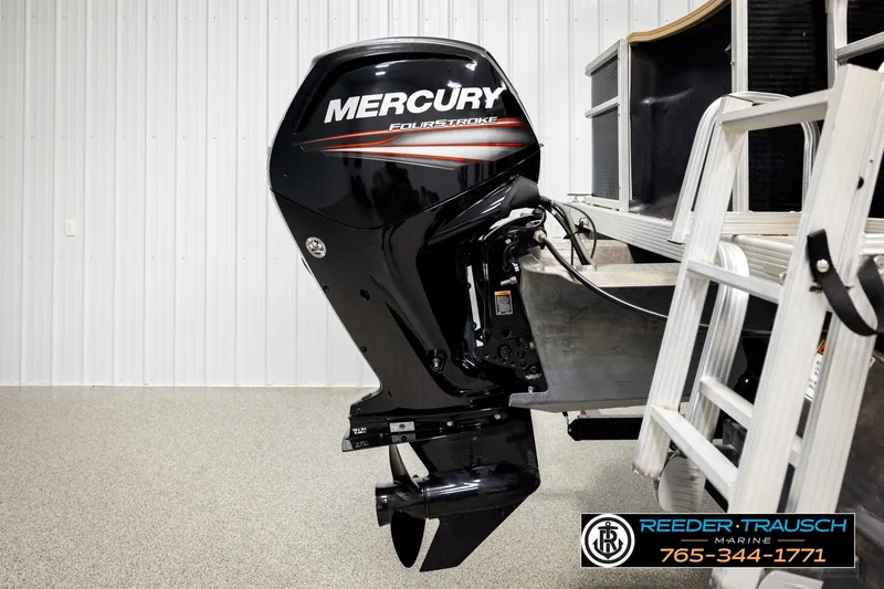 Slide: The Image of Mercury FourStroke engine on a 2018 Bennington SX RF boat, displayed indoors. - 47