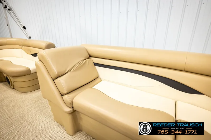 Slide: The Image of 2018 Bennington SX RF boat interior with beige seating, showcased by Reeder Trausch Marine. - 20