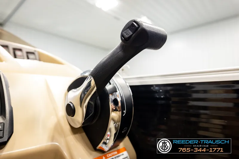 Slide: The Image of Throttle control of a 2018 Bennington SX RF boat in a showroom setting. - 39