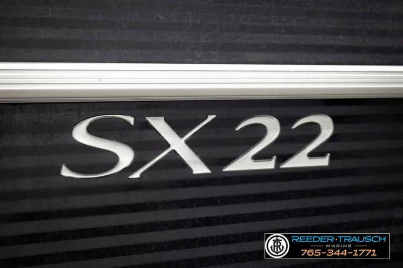 Slide: The Image of 2018 Bennington SX RF SX22 boat model emblem with dealership contact information. - 54