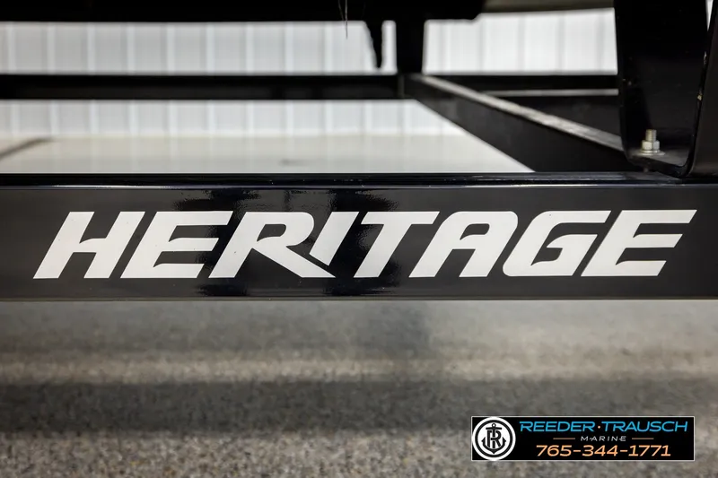 Slide: The Image of Close-up of 'Heritage' logo on a 2018 Bennington SX RF trailer at Reeder Trausch Marine. - 51