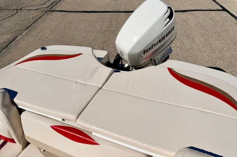 Slide: The Image of 2003 Glastron GX 180 Ski & Fish boat with Johnson outboard motor, beige and red upholstery. - 24