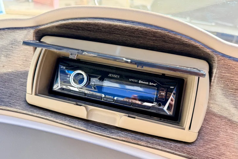 Slide: The Image of Jensen stereo system in 2003 Glastron GX 180 Ski & Fish boat dashboard. - 44