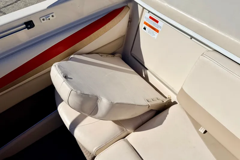 Slide: The Image of 2003 Glastron GX 180 Ski & Fish boat interior with beige seating and red accent. - 28