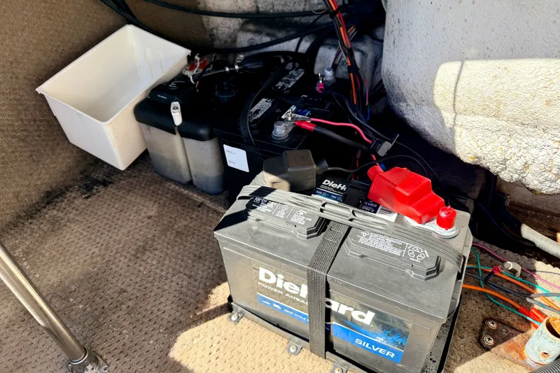 Slide: The Image of 2003 Glastron GX 180 Ski & Fish boat battery compartment with DieHard Silver battery. - 26
