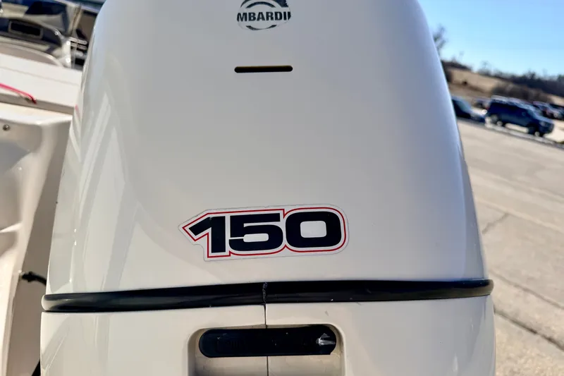 Slide: The Image of Outboard motor on 2003 Glastron GX 180 Ski & Fish boat, featuring "150" decal. - 17