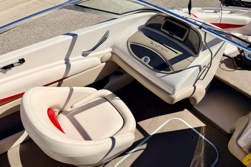 Slide: The Image of 2003 Glastron GX 180 Ski & Fish boat interior with beige seating and dashboard. - 40