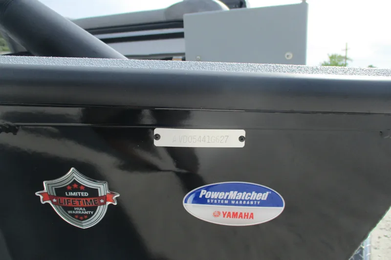 Slide: The Image of 2027 Avid 20 Rogue CC boat with warranty badges and serial number plate. - 13