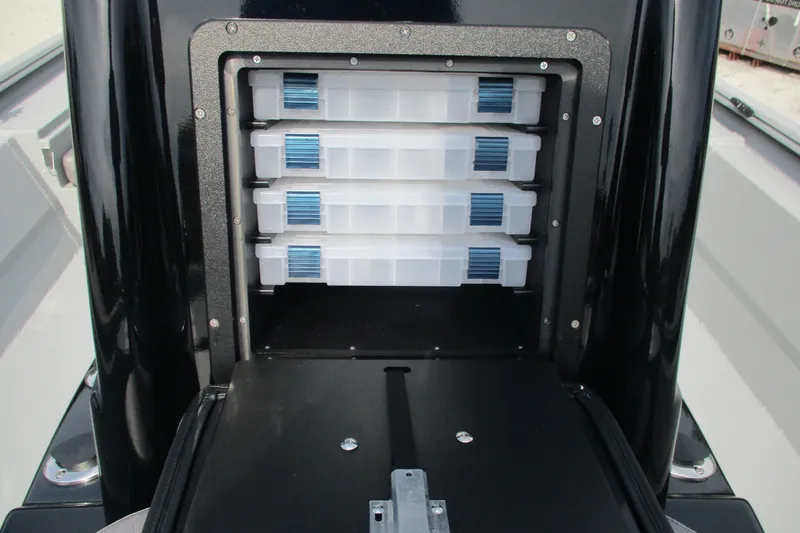 Slide: The Image of Storage compartment with tackle boxes in 2027 Avid 20 Rogue CC boat. - 10